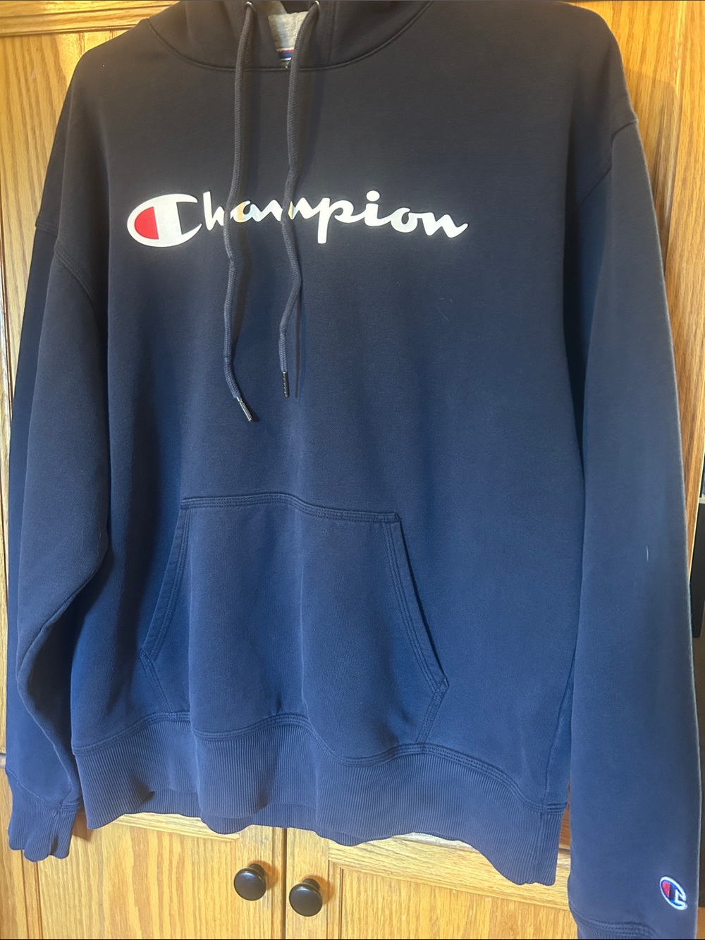 Champion Navy Hoodie with White Script and Red Accent